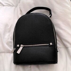 Small black leather backpack or crossbody purse